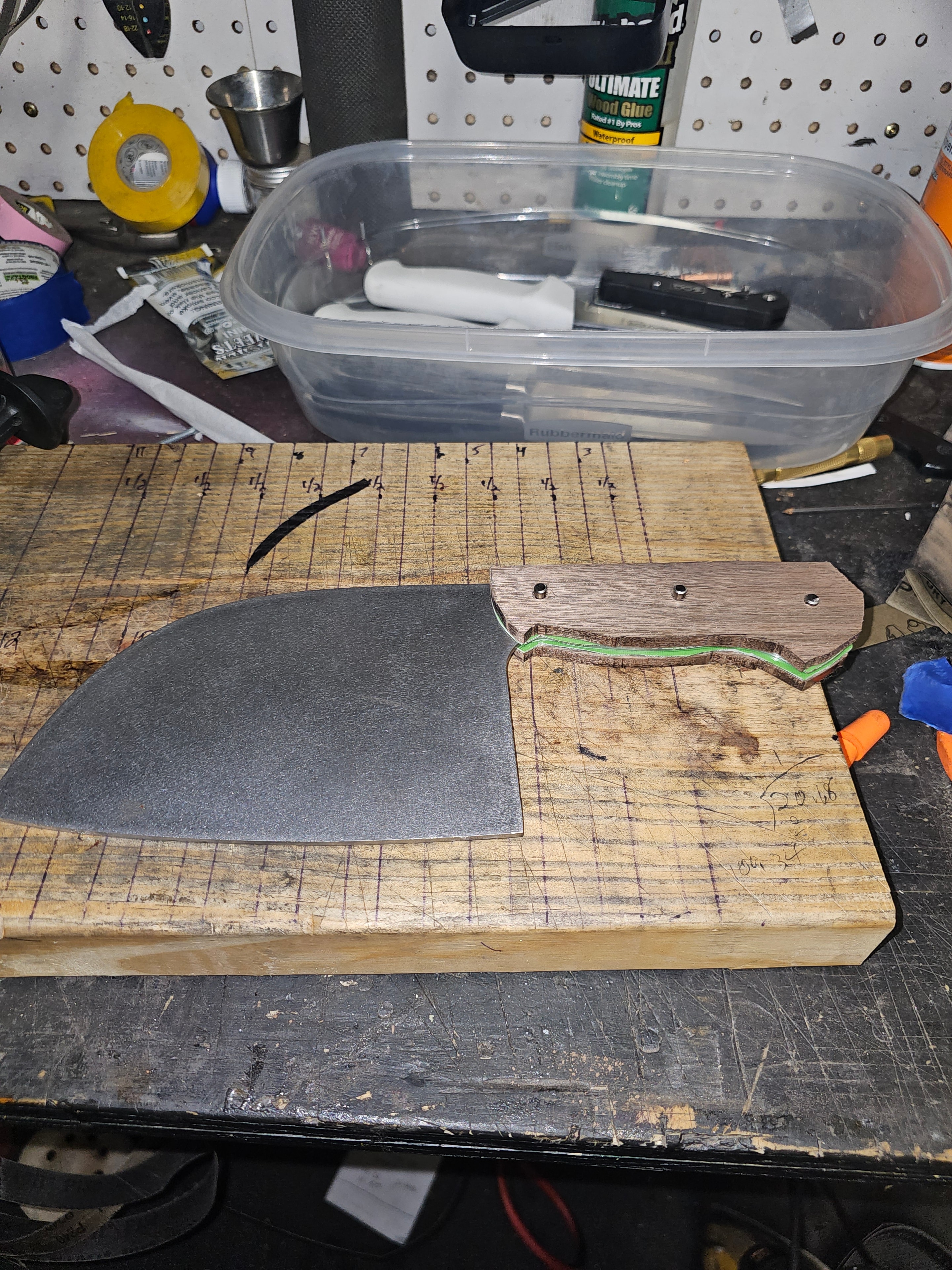 Custom cleaver with walnut handle being assembled on workbench