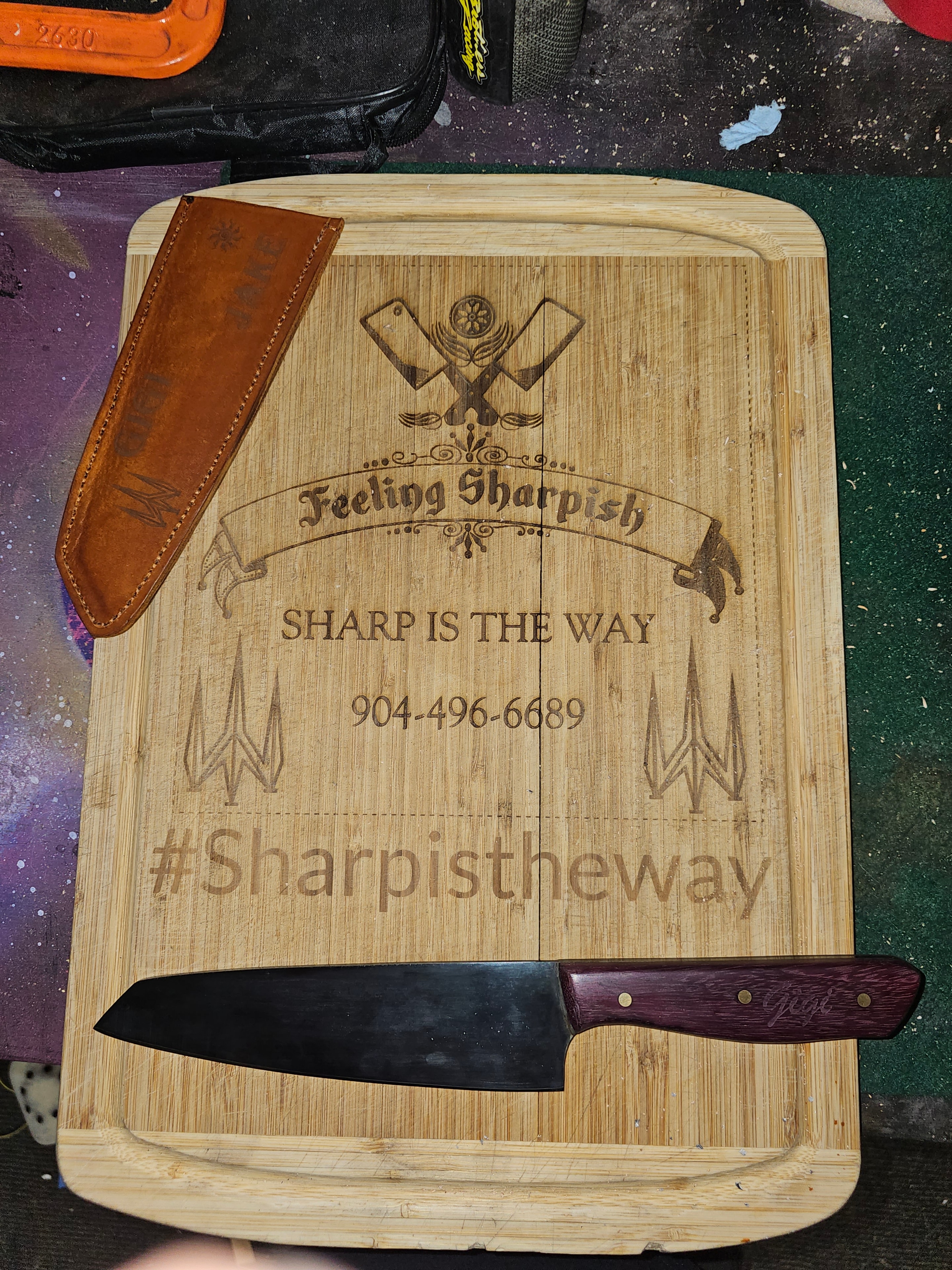 Feeling Sharpish branded cutting board with custom chef knife and leather sheath