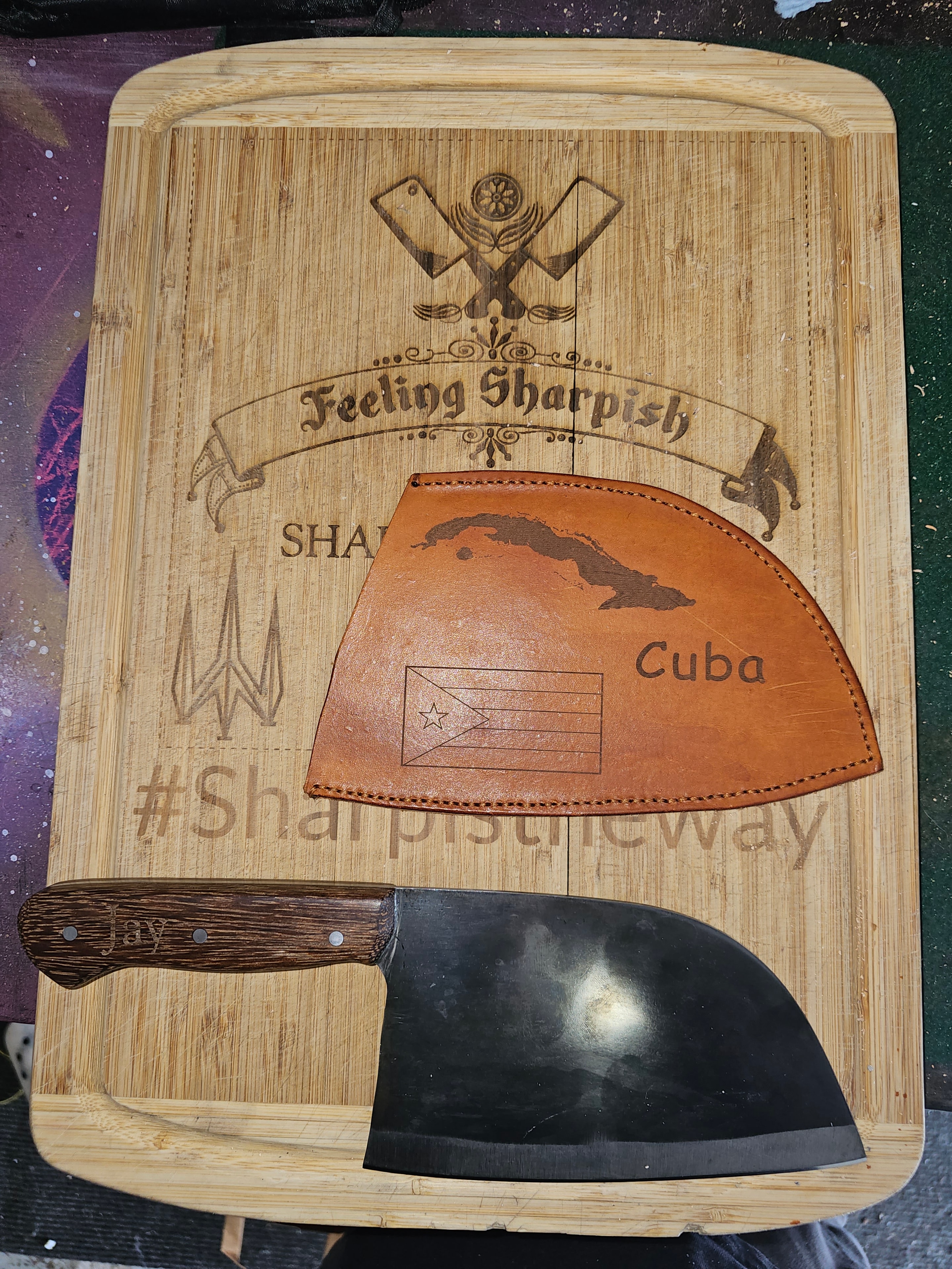 Feeling Sharpish branded cutting board with custom cleaver and Cuba leather sheath
