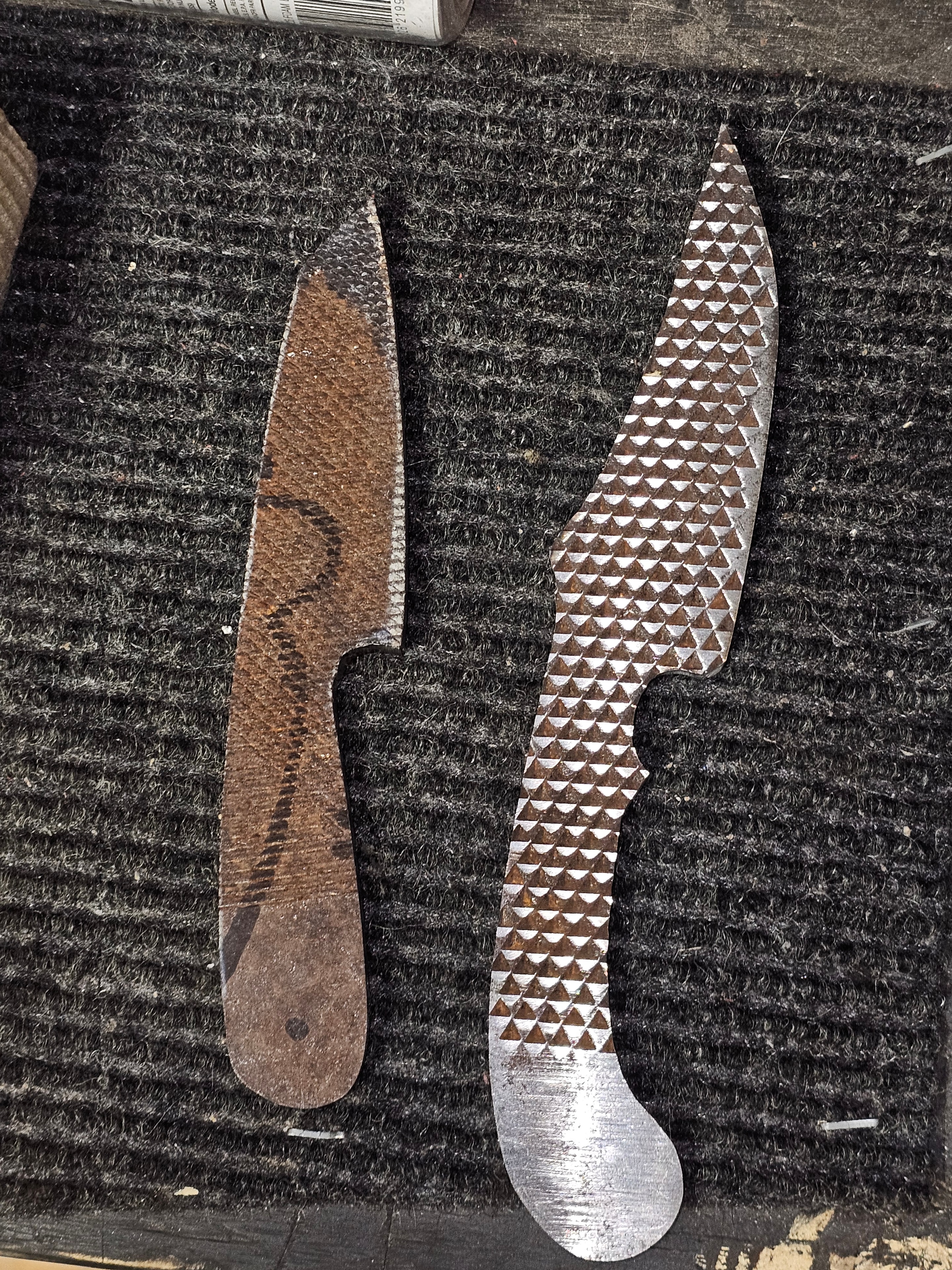Custom knife handle scale material samples in chevron and solid brown patterns