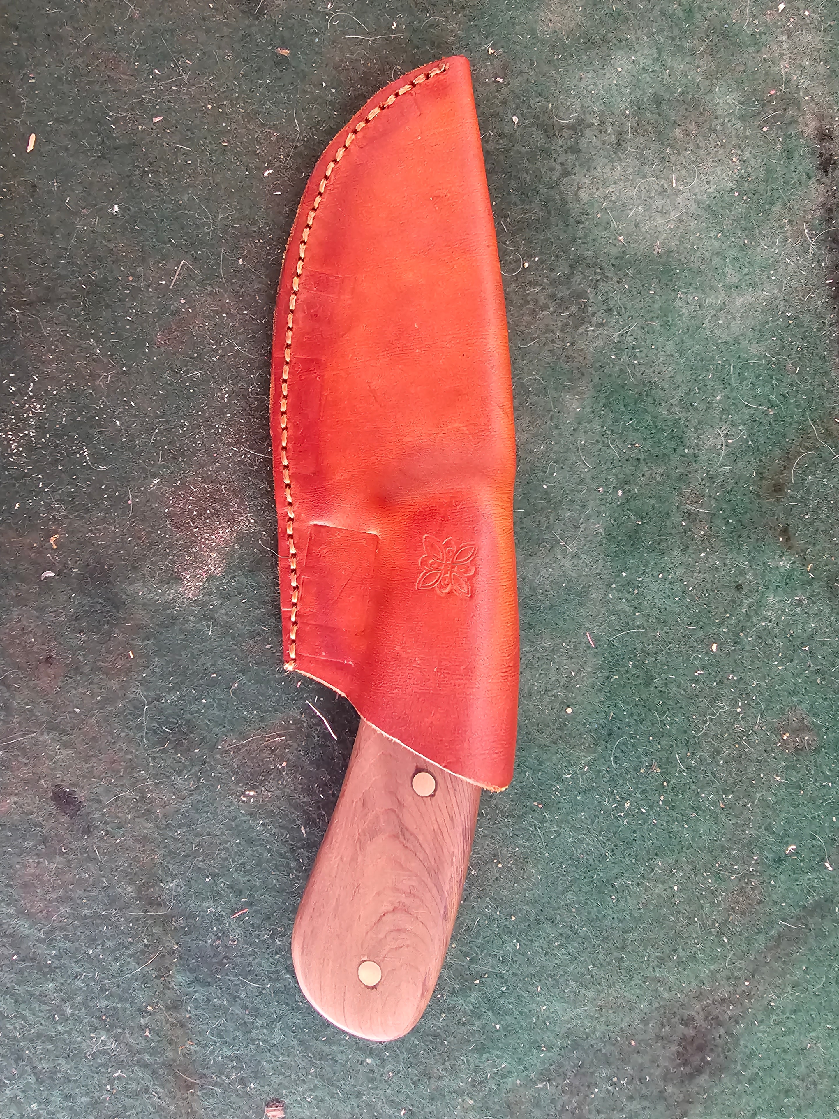 Custom red leather knife sheath with wood handle closeup
